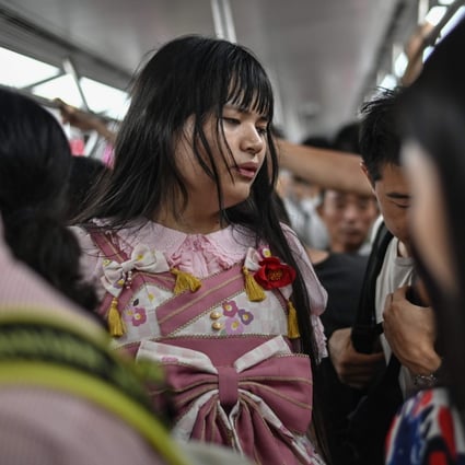 Alice (centre), a 23-year-old trans person, riding an underground train in the city of Chengdu in China’s Sichuan province. Photo: AFP