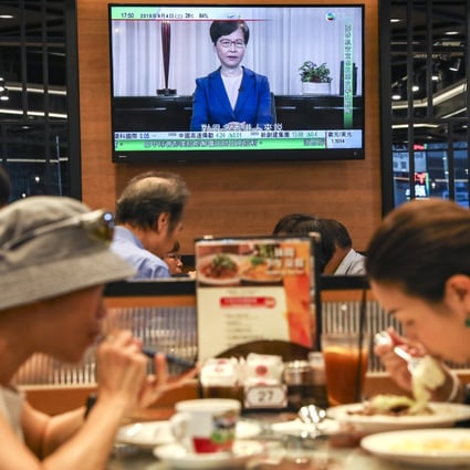Hongkongers continue to eat as Chief Executive Carrie Lam speaks during a pre-recorded message televised on September 4, as she announced the withdrawal of the extradition bill and an independent study to probe social ills. Photo: Robert Ng