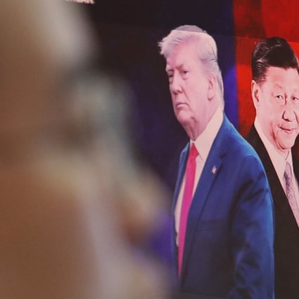 A computer screen shows images of US President Donald Trump and Chinese President Xi Jinping as a currency trader works in South Korea. Photo: AP