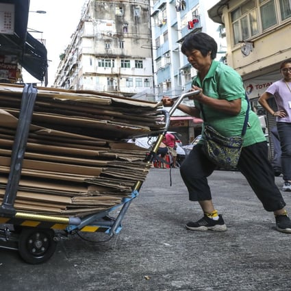 A cardboard granny puts on the new Polytechnic University trolleys through its paces in To Kwa Wan. Photo: Dickson Lee