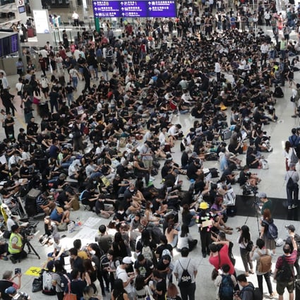 Protesters stage a sit-in at Hong Kong International Airport on August 9. Photo: Edmond So