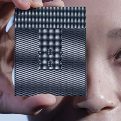 A Kunpeng 920 chip is displayed during an unveiling ceremony in Shenzhen, China, Monday, Jan. 7, 2019. Chinese telecom giant Huawei unveiled a processor chip for data centers and cloud computing as it expands into an emerging global market despite Western warnings the company might be a security risk. (AP Photo/Vincent Yu)