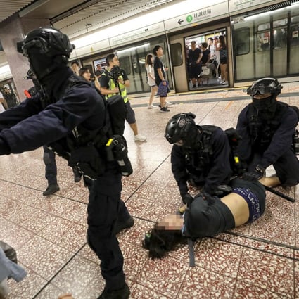 Riot police arrest an anti-government protester in Prince Edward MTR station on August 31. Photo: Handout