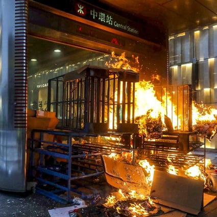 A fire burns on September 8 at one of the entrances to Central MTR station, in the business and financial heart of Hong Kong, during yet another weekend of violent protests. Photo: Edmond So