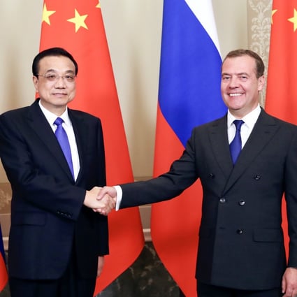 Chinese Premier Li Keqiang and Russian Prime Minister Dmitry Medvedev say they are committed to boosting trade. Photo: Xinhua