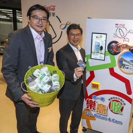 From left, William Yu, chief executive of World Green Organisation, Sunny Cheung, CEO of Octopus Cards, and Neil Waters, executive director at Swire Coca-Cola, at the launch of the reverse vending machines in Hong Kong on Thursday. Photo: May Tse