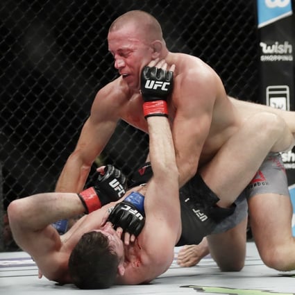Georges St-Pierre fights Michael Bisping at UFC 217. Photo: AP