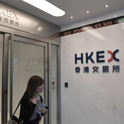 People walk out of the Stock Exchange of Hong Kong offices in the Central district of Hong Kong. Equities on the Hong Kong stock exchange have taken a hit in the past few sessions. Photo: AFP