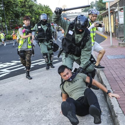 Riot police arrest an anti-government protester on September 22. Photo: Sam Tsang
