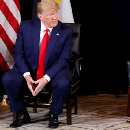 U.S. President Donald Trump looks on as Treasury Secretary Steve Mnuchin explains a delay in a Chinese agricultural trade delegation visiting the U.S. Photo: Reuters