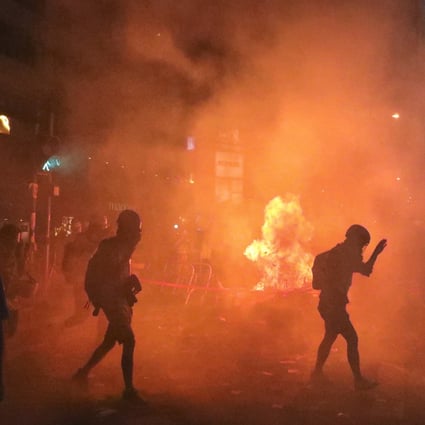 Protesters throw petrol bombs and light fires during a day of mayhem on Sunday. Photo: Felix Wong