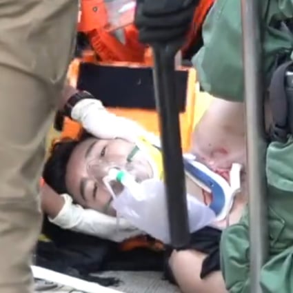 A screen capture from Stand News footage shows the teen being treated for his wound.