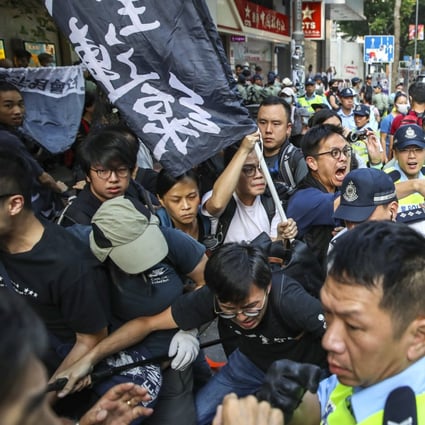 Police officers arrest suspects in the Hong Kong district of Wan Chai after scuffles on Tuesday. Photo: Winson Wong