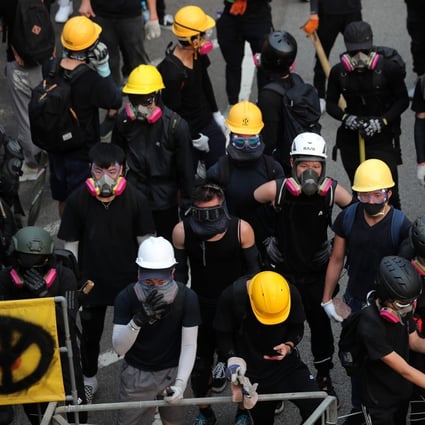 Anti-government protesters in Hong Kong routinely cover their faces with surgical masks, gas masks and scarves. Photo: Sam Tsang