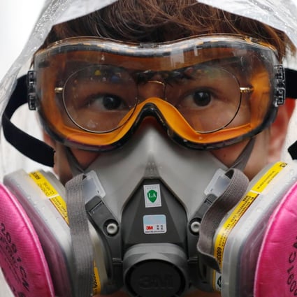 Wearing masks could be made illegal under a new Hong Kong law. Photo: Reuters