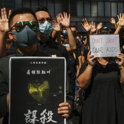 Protesters hold a flash mob rally at Chater Garden in Central on October 2, in support of a Secondary Five student who was shot by a police officer during scuffles following a mass rally the previous day, the 70th anniversary of the founding of the People’s Republic of China. Photo: Sam Tsang
