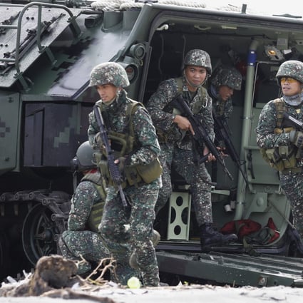 Troops from the Philippine Marines and Armed Forces reservists conduct an amphibious landing exercise. Photo: EPA
