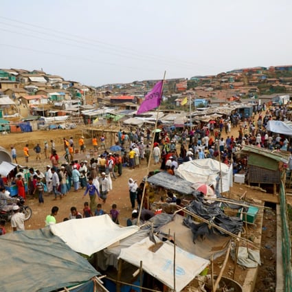 Rohingya refugees gather at a market inside a refugee camp in Cox's Bazar, Bangladesh, in March. Photo: Reuters
