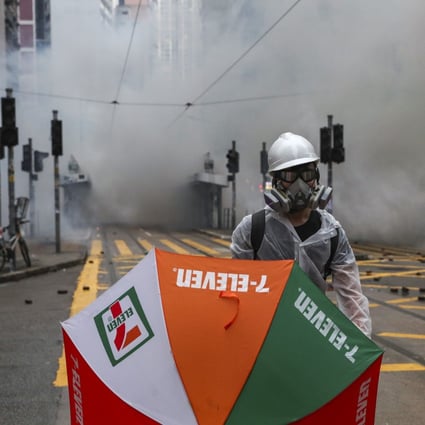 Clouds of tear gas have little effect on an anti-government protester in Wan Chai. Photo: Sam Tsang