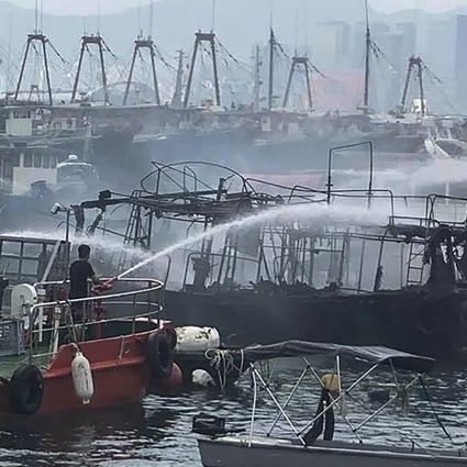 Firefighters putting out the flames at the typhoon shelter. Photo: Facebook