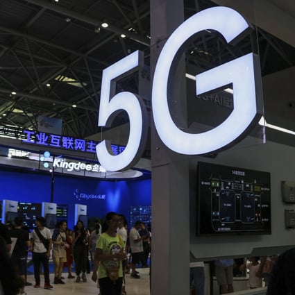 Visitors tour an exhibitor booth with a 5G on display at the Smart China Expo in southwest China's Chongqing Municipality, 2019. Photo: AP