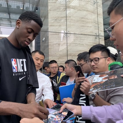 The Brooklyn Nets’ Caris LeVert signs autographs for fans outside the Shanghri-La hotel in Shanghai. Photo: Thomas Yau