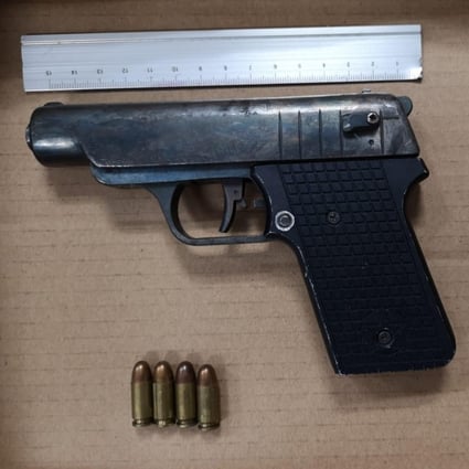 The pistol and four rounds of live ammunition were found along with other weapons in a car parked in Deep Bay Road on Wednesday afternoon. Photo: Handout