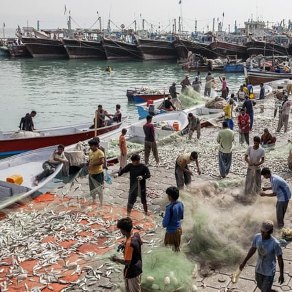 Fishermen at the harbour in Gwadar, Balochistan, Pakistan. What used to be a small fishing town has been transformed by Chinese investment. Photo: Bloomberg