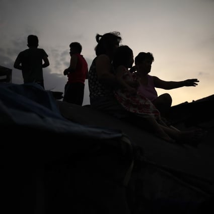 Filipino children on the roof of a dilapidated government housing project in Manila. Photo: EPA-EFE