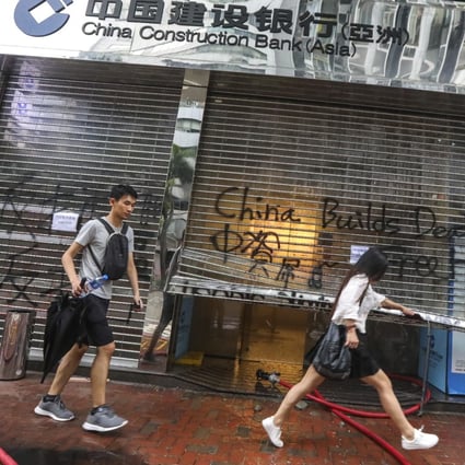 A China Construction Bank branch vandalised by protesters following a rally in defiance of the anti-mask law issued by the government on October 5, 2019. Photo: Felix Wong