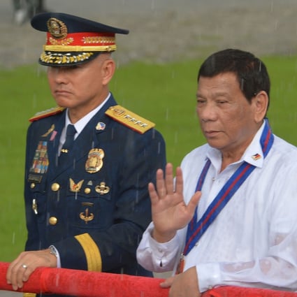 Former Philippine national police chief Oscar Albayalde and Philippine President Rodrigo Duterte during a police event in Manila. Photo: AFP