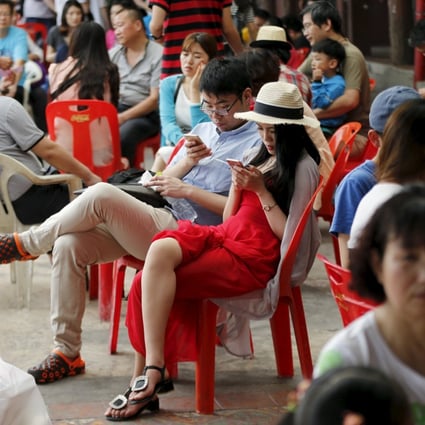 Chinese tourists wait for a boat at a pier at Chao Phraya River in Bangkok. Photo: Reuters