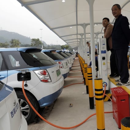 A fleet of new electric-powered taxis are charged at a public charging station in the hi-tech hub of Shenzhen, in southern China's Guangdong province, on January 7. Photo: AP