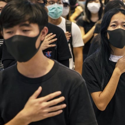 Hong Kong protesters in their “uniform” of black T-shirts at a shopping mall in Yuen Long district. Chinese customs authorities have banned the shipping of black clothing to Hong Kong. Photo: EPA-EFE