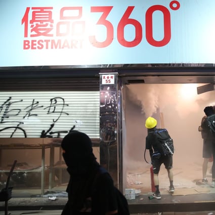 Protesters vandalise a BestMart 360 store in Tsuen Wan. Photo: Winson Wong