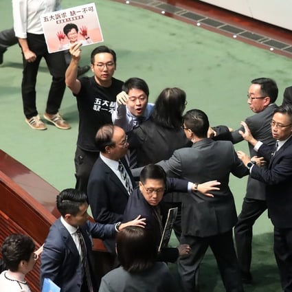 Rowdy opposition lawmakers forced Carrie Lam to leave the Legco chamber early. Photo: K.Y. Cheng