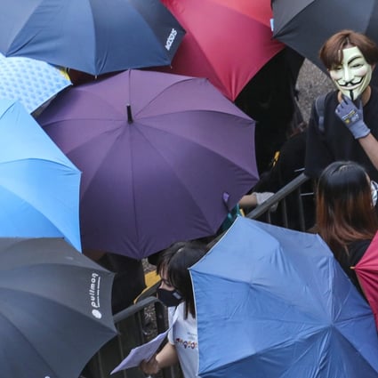 Protesters in Central defy the mask ban. Photo: Felix Wong
