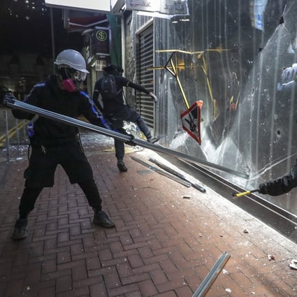 Anti-government protesters vandalise a Bank of China branch, in Tsuen Wan on October 13. Photo: Edmond So
