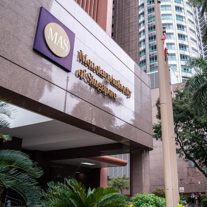 Signage for the Monetary Authority of Singapore is displayed outside the central bank's headquarters. Photo: Bloomberg