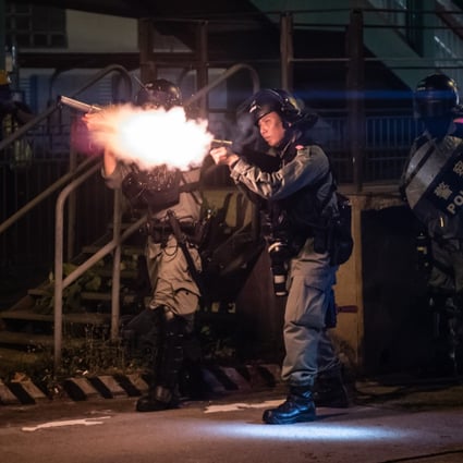 Riot police fire tear gas during pro-democracy demonstrators in Hong Kong on October 21. Photo: AFP