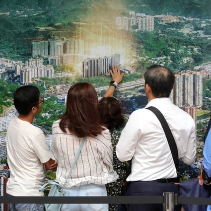 Potential buyers queue up for their turn to buy flats in China Evergrande’s Emerald Bay residential project in Tuen Mun. Photo: May Tse
