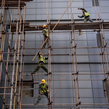 Workers erect scaffolding at a construction site in Beijing in 2019. China came fourth in a new report’s measure comparing 114 economies across traditional growth drivers such as infrastructure building. Photo: AFP