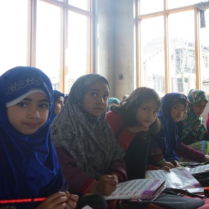 Year 1 students attending an English class at the school set up in Ghulam Mohammad Ganai’s house in Samboora. Photo: Adnan Bhat
