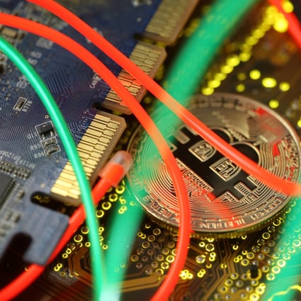 Representation of the Bitcoin virtual currency seen on a PC motherboard in this illustration picture. Photo: Reuters