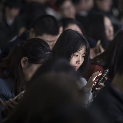 An attendee uses her smartphone during Tencent Holdings' WeChat Open Class Pro conference in Guangzhou last year. For the fourth straight year, the internet in China was ranked the least free among surveyed nations, Freedom House says. Photo: Bloomberg
