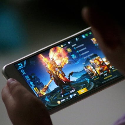China has extended restrictions on minors playing video games, aimed at reducing gaming addiction, to mobile titles. Photo: Reuters