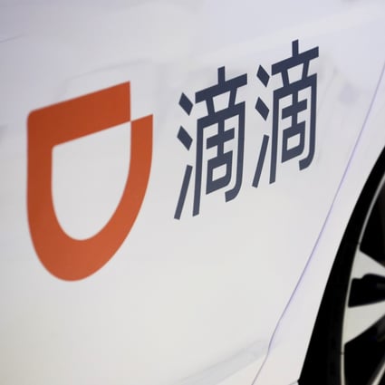 The logo of ride hailing company Didi Chuxing is seen on a car door at the IEEV New Energy Vehicles Exhibition in Beijing, China October 18, 2018. Photo: Reuters