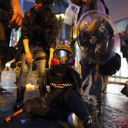 Police arrest a protester during a demonstration in August. Allegations of excessive force by police are being investigated by the Independent Police Complaints Council. Photo: AP Photo
