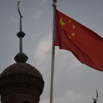 A Chinese flag flies over a mosque in Kashgar, Xinjiang. Photo: AFP