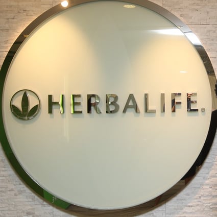 ExHerbalife executives Li Yanliang and Yang Hongwei charged in US with